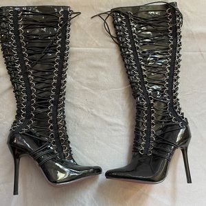 Size 5 stilettos black tie up, new, never worn, has shelf storage wear